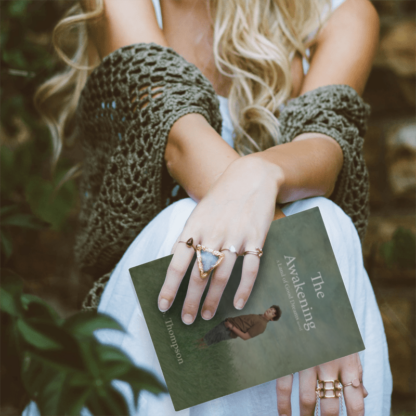 woman holding book The Awakening